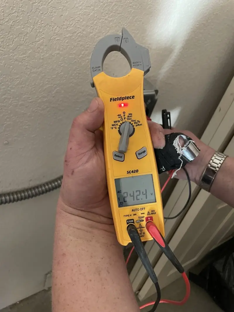 Voltage testing with clamp meter during Outlet Installation in Minnehaha